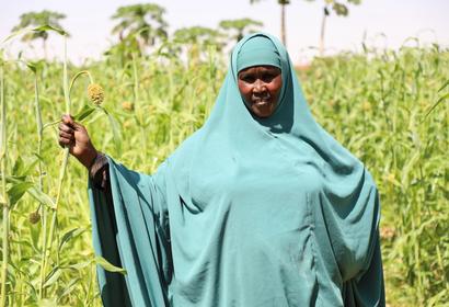 Somali Women standing in her farm