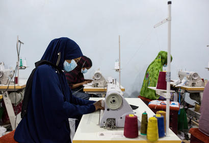 Woman sewing at Tayo